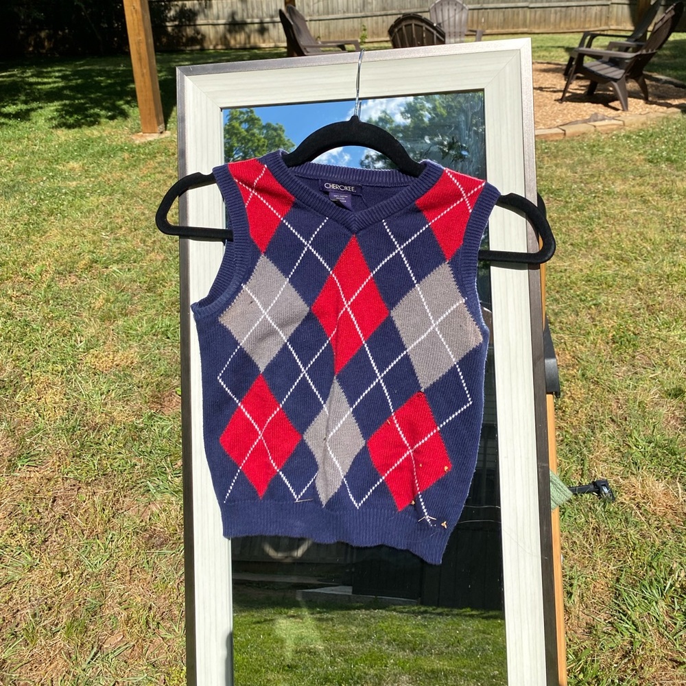 Cropped sweater vest from Brandy.